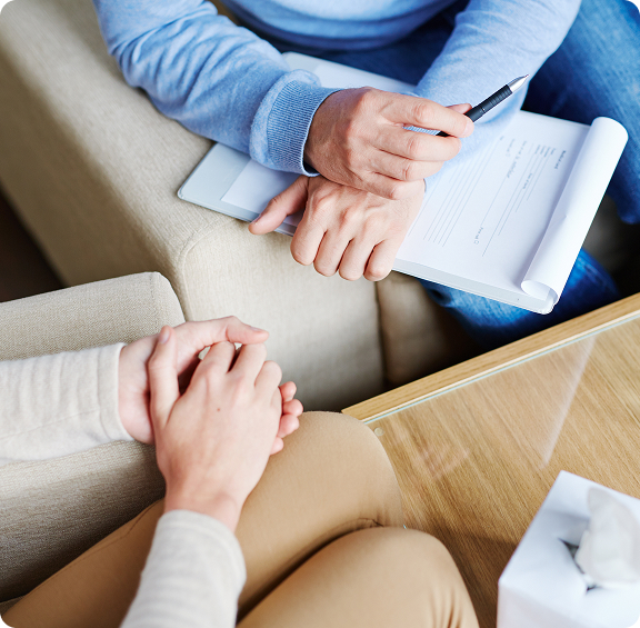 young-man-communicating-with-participants-group-therapy-community-center-2 CBT Therapy